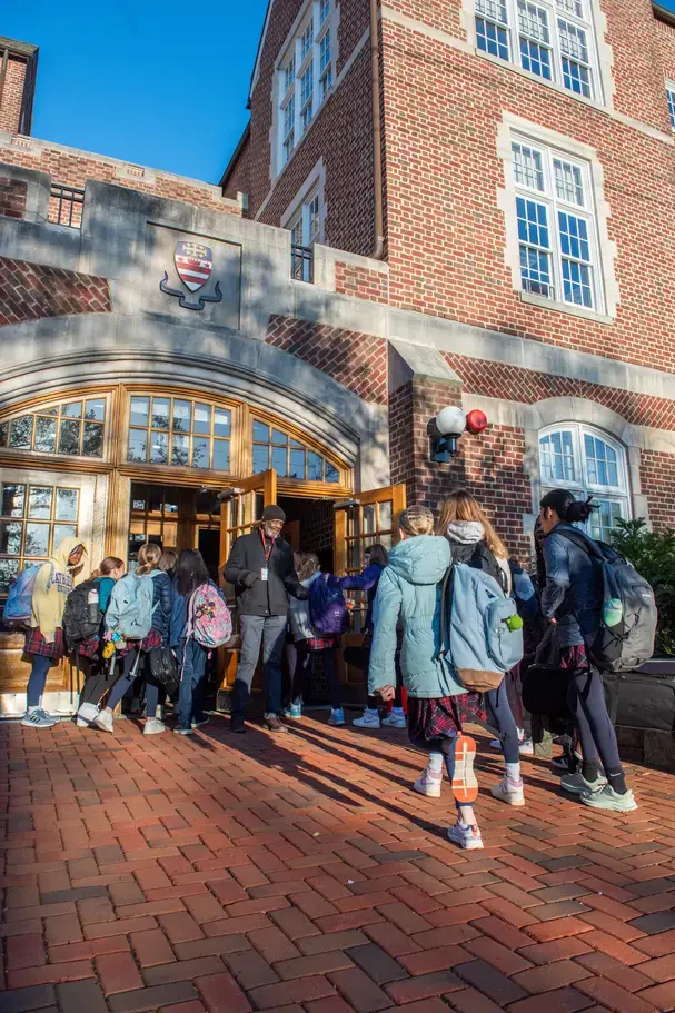 students entering NCS school building