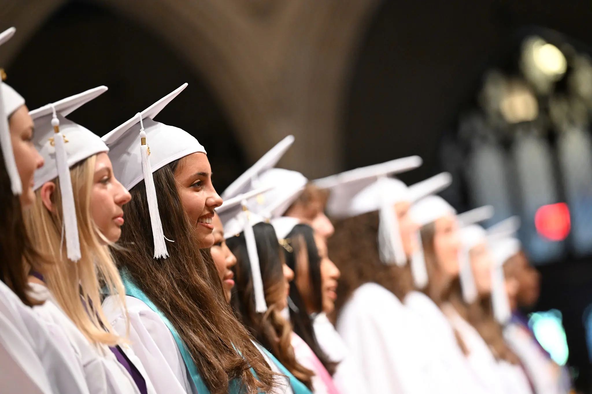 NCS girls in white graduation robe