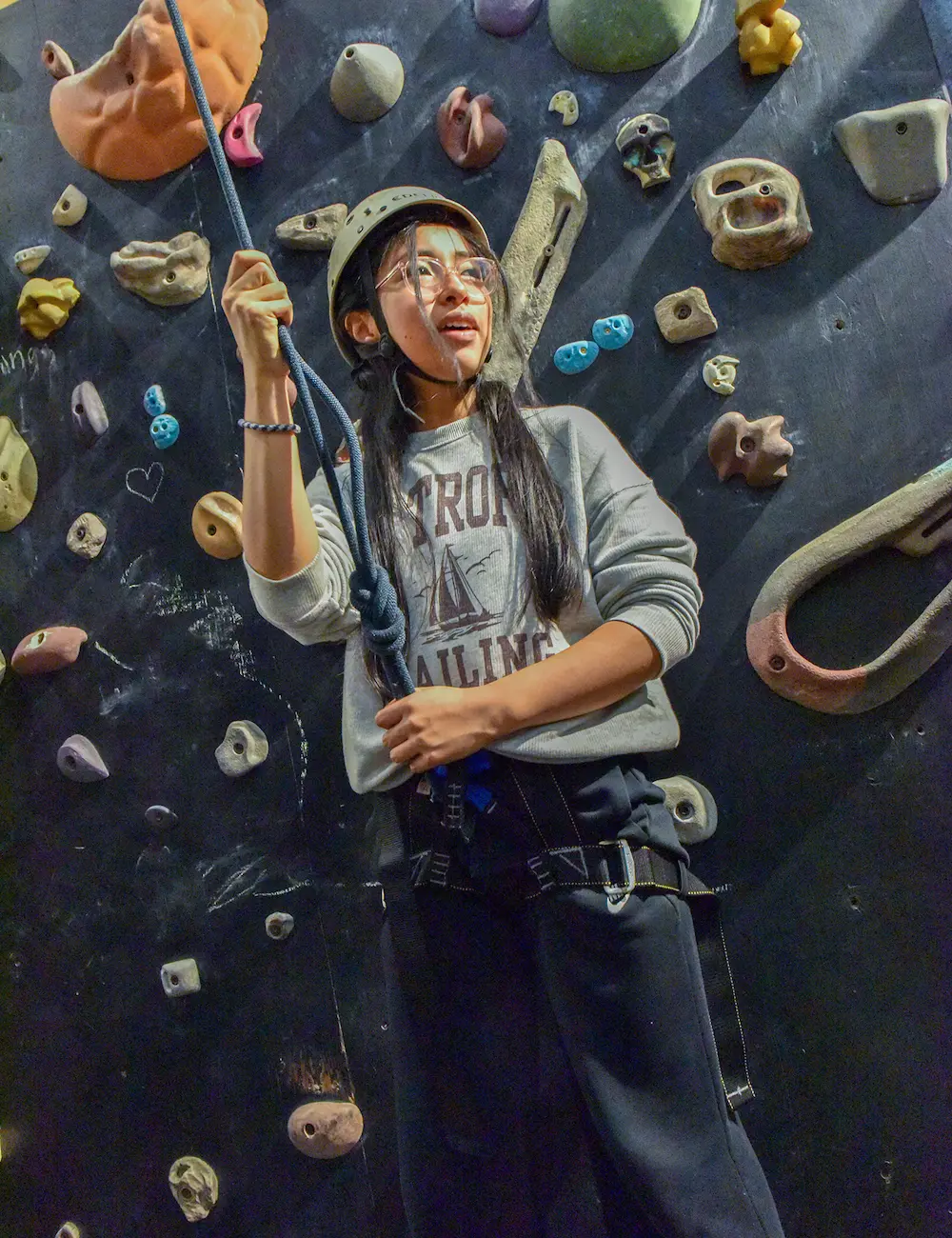 Girl on climbing wall at NCS